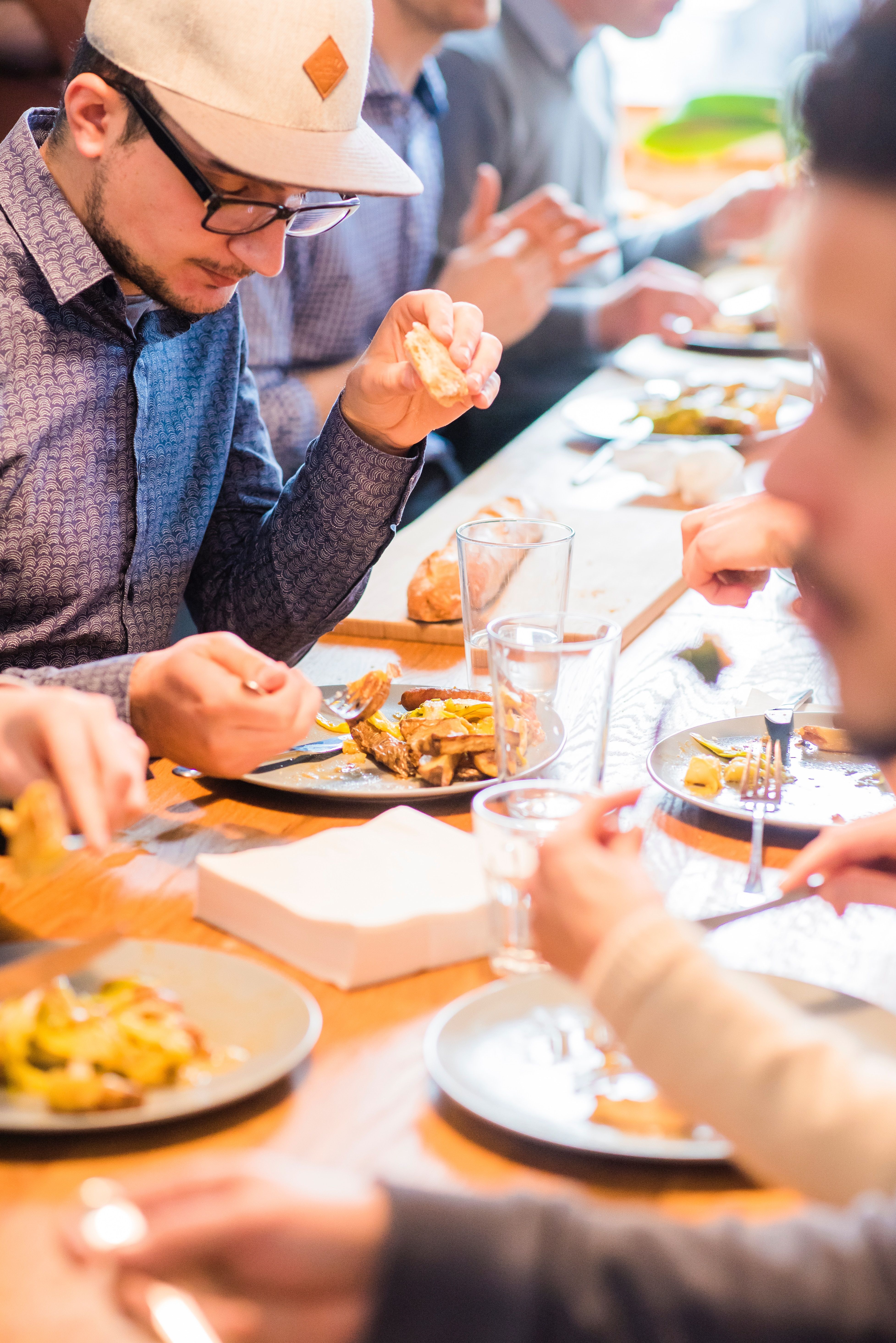 Restaurant marketing — guests dining in a full restaurant after an effective local marketing campaign